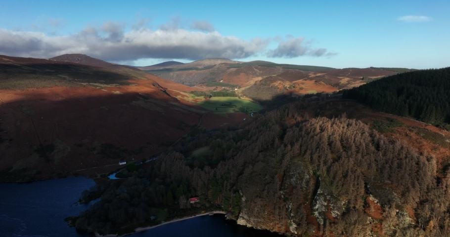 Lough Dan, Wicklow, Ireland. December 2021 Drone pushes northeast above the lake towards Roundwood with Lough Tay in the distance.