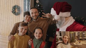 Split screen of happy family of four and grandfather dressed as Santa Claus video calling woman making gingerbread house with her daughter at home