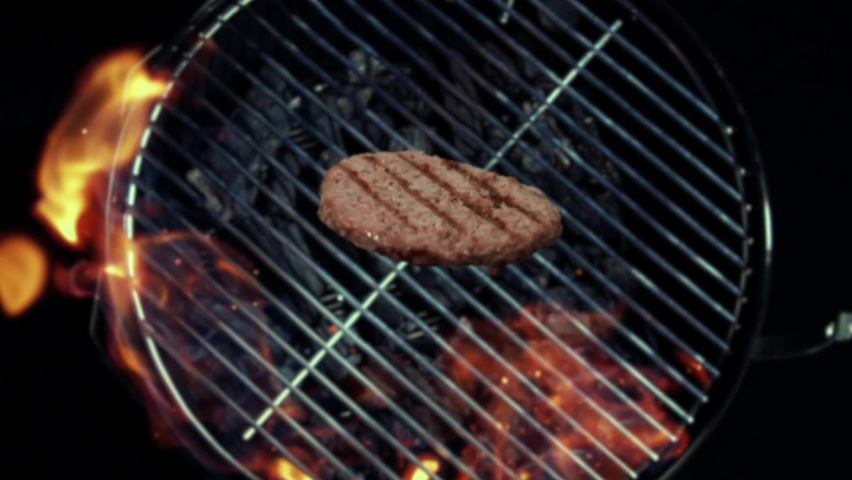 Grilled burger patty flies off the grill towards the audience. Shot in slow motion. 
You get the edited version and the single shots. Royalty-Free Stock Footage #1084351339