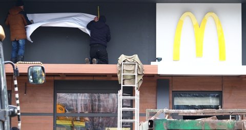 Belarus, Minsk, 2021.Workers carry out renovation of the McDonald's restaurant building