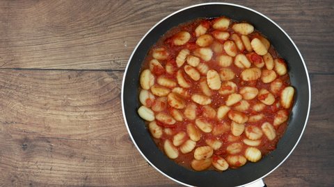 Cooking Gnocchi with Tomato Sauce with Room for Copy