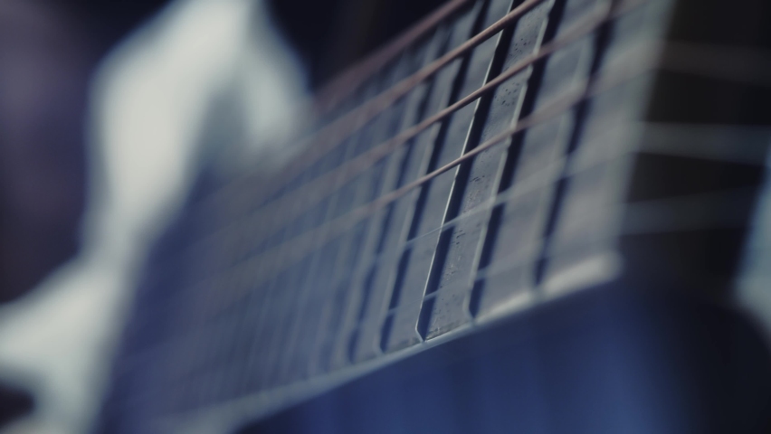 The musician plays the acoustic guitar. Closeup of the right hand. Macro shooting. Depth of field Royalty-Free Stock Footage #1084365877
