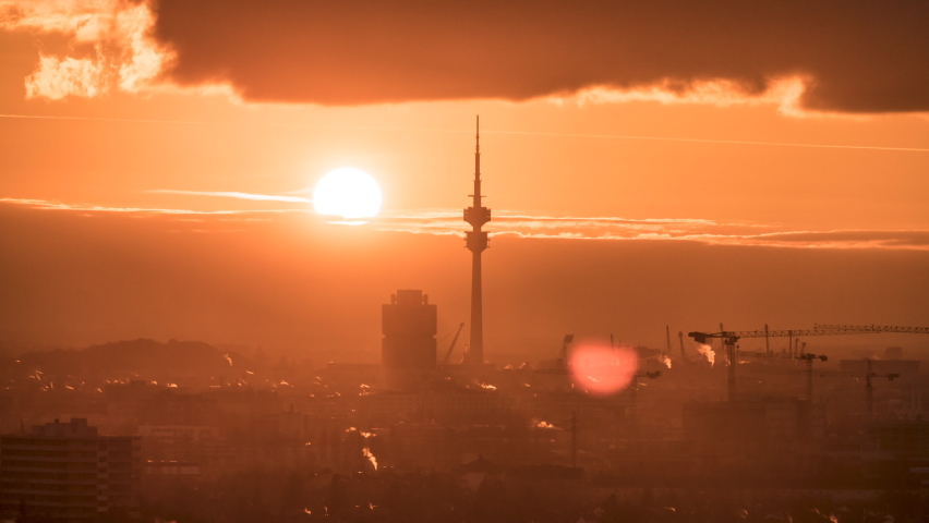 Beautiful Sunset over Munich city skyline, munich aerial view downtown tv tower at sunset colored sky. Munchen germany.  Royalty-Free Stock Footage #1084374250