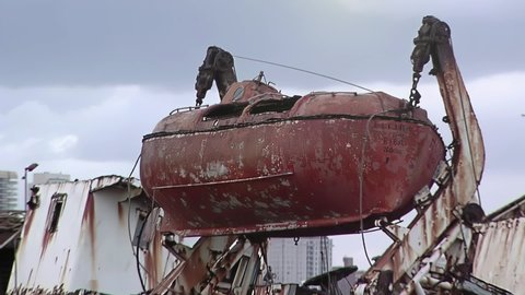 An Old Rusty Lifeboat aboard an Abandoned Wrecked Ship at Ship Graveyard in Mar del Plata, Argentina. Zoom In.