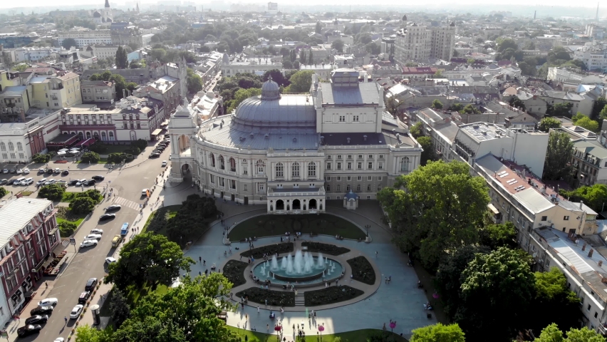 View from the drone Odessa National Academic Opera and Ballet Theater. One of the largest theaters in Ukraine. People are resting near the fountain of the Odessa Opera and Ballet Theater. Odessa drone