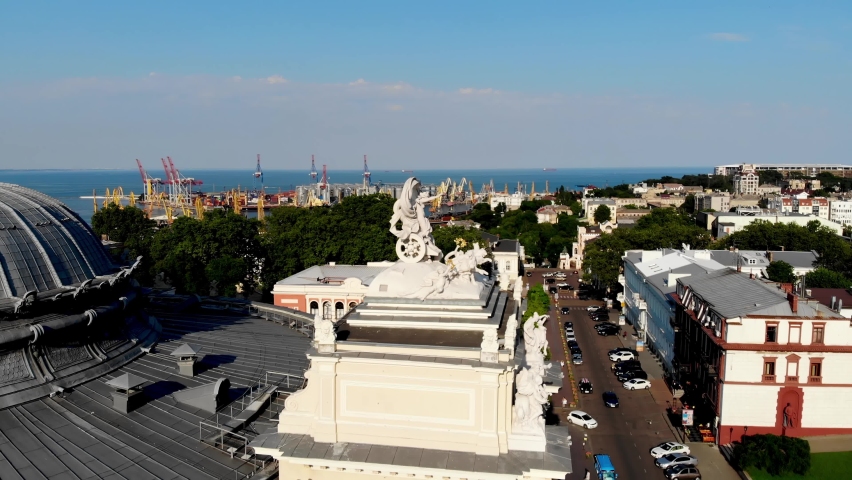 View from the drone Odessa National Academic Opera and Ballet Theater. One of the largest theaters in Ukraine. People are resting near the fountain of the Odessa Opera and Ballet Theater. Odessa drone