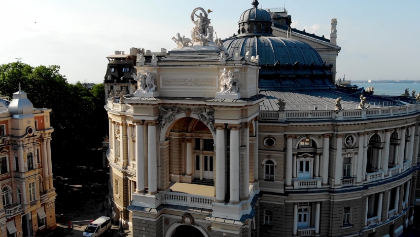 View from the drone Odessa National Academic Opera and Ballet Theater. One of the largest theaters in Ukraine. People are resting near the fountain of the Odessa Opera and Ballet Theater. Odessa drone