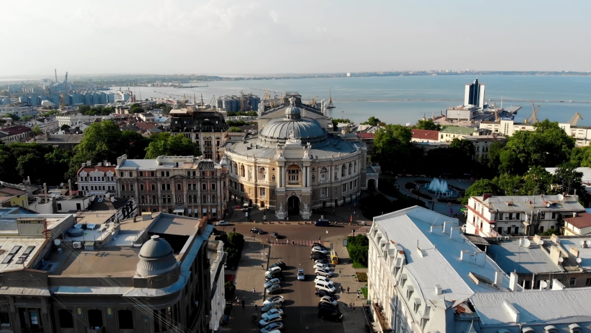 View from the drone Odessa National Academic Opera and Ballet Theater. One of the largest theaters in Ukraine. People are resting near the fountain of the Odessa Opera and Ballet Theater. Odessa drone | Shutterstock HD Video #1084380271