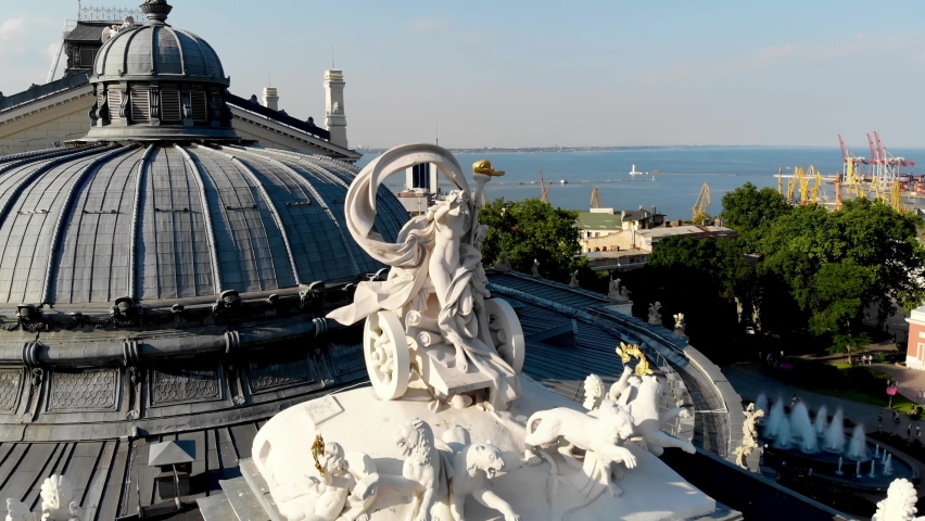 View from the drone Odessa National Academic Opera and Ballet Theater. One of the largest theaters in Ukraine. People are resting near the fountain of the Odessa Opera and Ballet Theater. Odessa drone