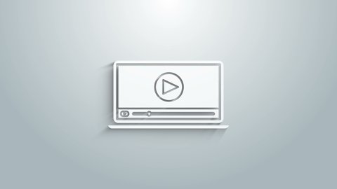 White Online play video icon isolated on grey background. Laptop and film strip with play sign. 4K Video motion graphic animation.