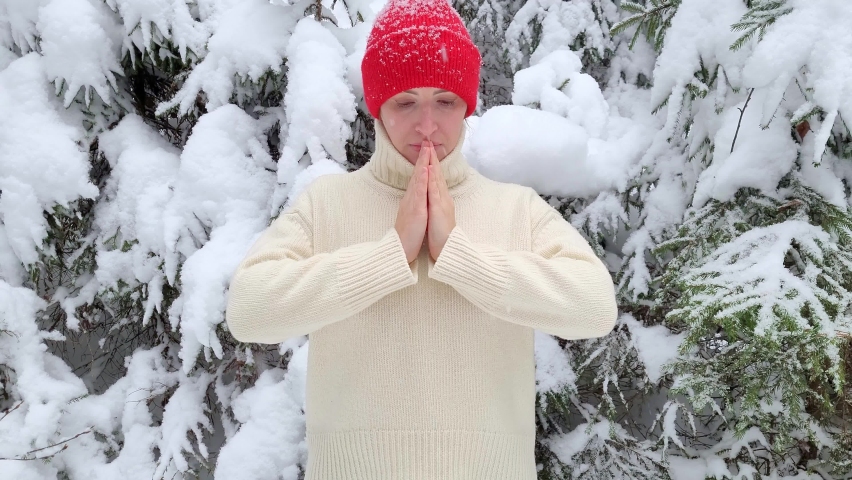 Smile Red heart in the caucasian woman hands opening, closing. Felt toy, winter forest, white ivory sweater. The concept of giving and confessing love for Valentine