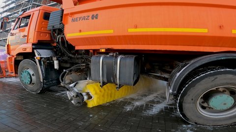Kaliningrad, Russia, 10, December, 2021:
A snowblower brush cleans the pavement from snow, close-up