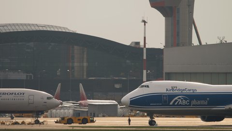 MOSCOW, RUSSIAN FEDERATION - JULY 29, 2021: Boeing 747 Airbridgecargo and Boeing 777 Aeroflot at Sheremetyevo Airport (SVO). Airbus A320 Aeroflot taxis in the background