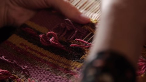 Handmade tapestry in slow motion Stockvideó