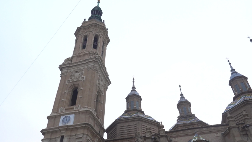 Side panning of the towers of the Basilica of Nuestra Señora del Pilar in the city of Zaragoza, next to the Ebro river in Aragon. Spain, 4k video