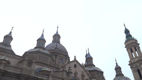 Side panning of the towers of the Basilica of Nuestra Señora del Pilar in the city of Zaragoza, next to the Ebro river in Aragon. Spain, 4k video