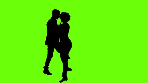 A Young couple dancing tango profesional dancers on Green Screen Silhouette Pair in argentinian spanish dress performs dance movement. 4K 60fps Argentina France Chroma key Argentina Buenos Aires Messi