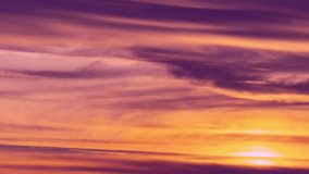 Timelapse of beautiful pink sunset sky turning to blue evening sky 4k cloudscape footage, purple clouds time lapse, beautiful cloudy motion. Beautiful pinc sunset sky turning to blue evening skies.