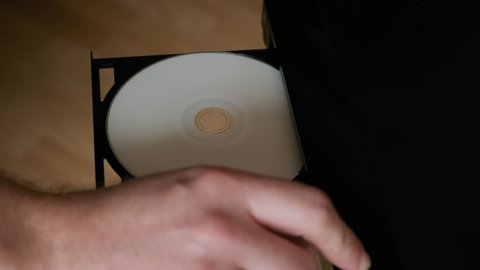 Shot Insert Disc to DVD player. Loading Compact Disc From The DVD, CD Player.