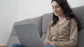 Professional young business woman doing remote work on lockdown. Portrait of beautiful white person doing communication over internet. Young adult Caucasian female working from home on laptop computer