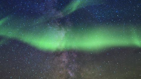 Milky way. Northern lights. Cosmos, twinkling stars, aurora. Time lapse background. Night sky. 29,97 fps 