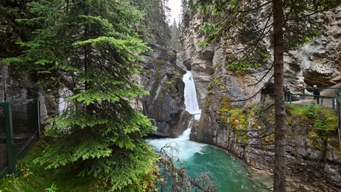 Johnston Canyon with cascade flowing in deep forest at Banff national park, Canada