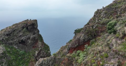 Island of Madeira coastline high rocky cliffs. Beautifull mountains nature and ocean landscpape in Portugal.