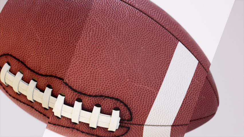Transition animation of a brown football on a plain white background for football broadcast from the Quarterback collection - Football Broadcast Sports Playback Element