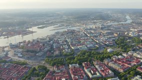 Inscription on video. Gothenburg, Sweden. Panorama of the city and the river Goeta Elv. The historical center of the city. Sunset. Neon white effect text, Aerial View, Point of interest