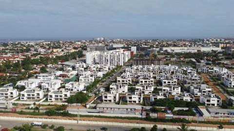 Talatona Luanda Angola - 12 20 2021: Aerial drone footage of Talatona city, residential area with condominiums with luxury houses and office buildings, metropolitan area of Luanda in Angola