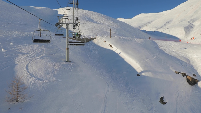 Using ski lift in the Alps in Val d