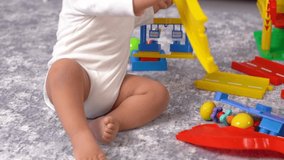 Baby exploring while playing.
The baby who develops while playing, learns and discovers life. This is a Slow motion video.