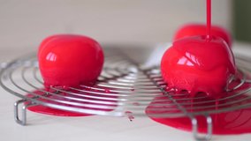 Re-glazing of individual mousse cakes with red glaze - Powered by Shutterstock - Get 15% off with code: PIKWIZARD15
