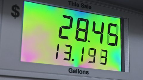 Digital counter count up the counter of a gas pump and rising gas prices