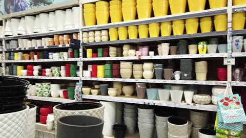 Flower garden pots on shelves. Store warehouse of materials for the improvement and repair of houses and countryside suburban areas Leroy Merlin. Perm, Russia, April-18,2021.