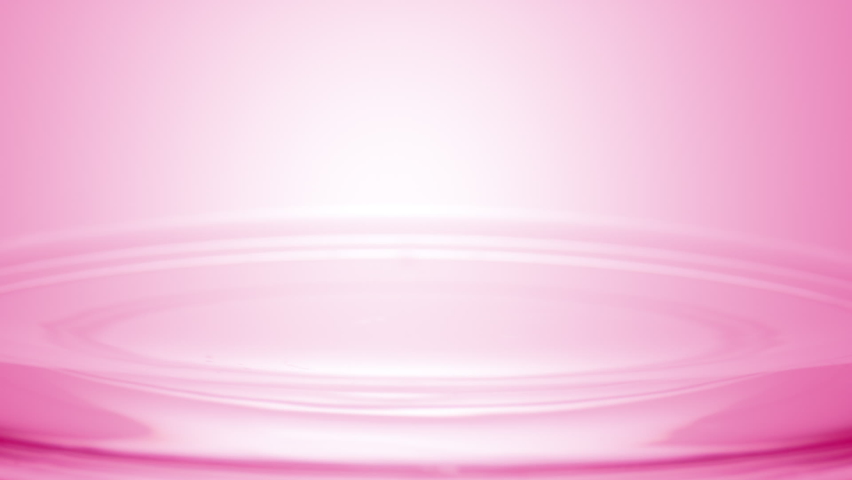 Pink drop falls down on the surface of pink transparent liquid creating concentric circles on pale pink background | Abstract skincare cosmetics formulation concept Royalty-Free Stock Footage #1084469854
