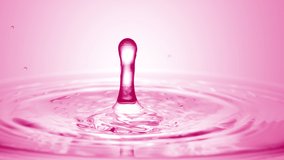 Pink drop falls down on the surface of pink transparent liquid creating concentric circles on pale pink background | Abstract skincare cosmetics formulation concept - Powered by Shutterstock - Get 15% off with code: PIKWIZARD15