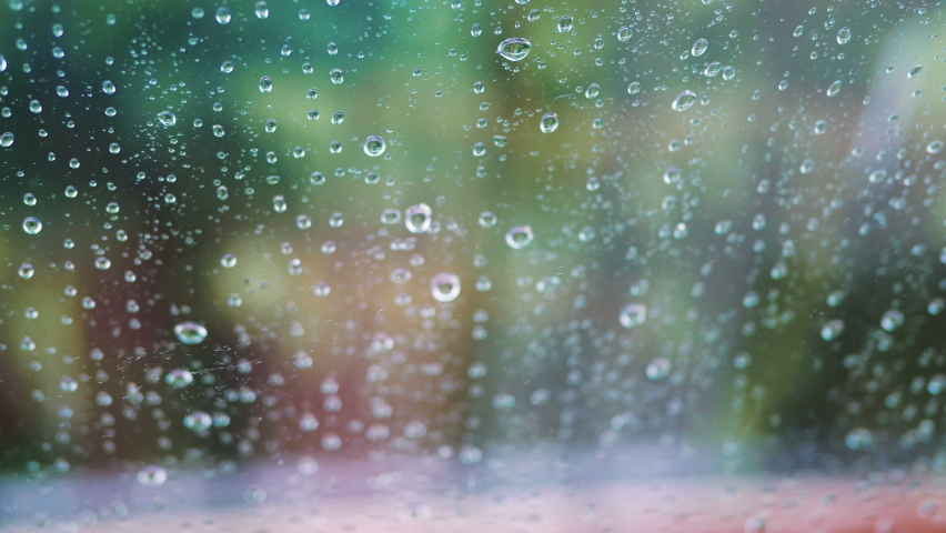 Rainy day behing the window in 4k slow motion 60fps