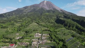 Aerial view of Stabelan village surrounded by vegetable gardens on the slopes of Mount Merapi, sunny afternoon - Powered by Shutterstock - Get 15% off with code: PIKWIZARD15