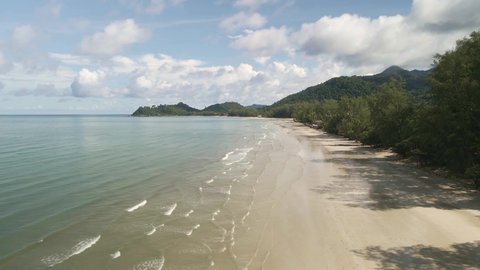 low angle aerial drone view of tropical beach on Koh Chang Island in Thailand