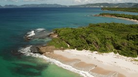 Beautiful aerial video shot of Martinique coast, Antilles with beautiful turquoise sea water and sandy coastline. Pointe de Marin in Caribbean island for holidays vacation. Vacation video footage.