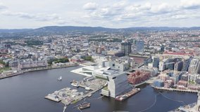 Inscription on video. Oslo, Norway. City center from the air. Embankment Oslo Fjord. Oslo Opera. Appears from the sand, Aerial View