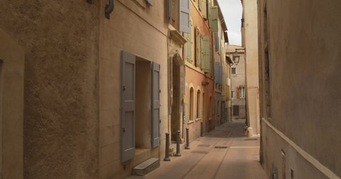 Empty narrow street in dim natural light south of France