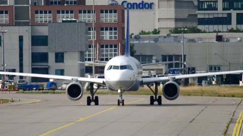 FRANKFURT AM MAIN, GERMANY - JULY 17, 2017: Passenger Airbus 320 Lufthansa taxiing the taxiway at Frankfurt Airport, Germany (FRA). Cockpit close-up, side view