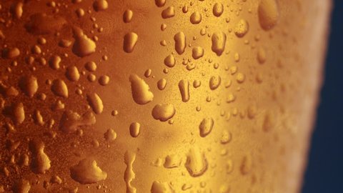 the light passes behind the glass of beer, air bubbles can be seen in the glass