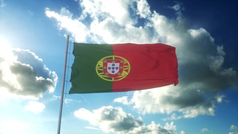 Flag of Portugal waving at wind against beautiful blue sky