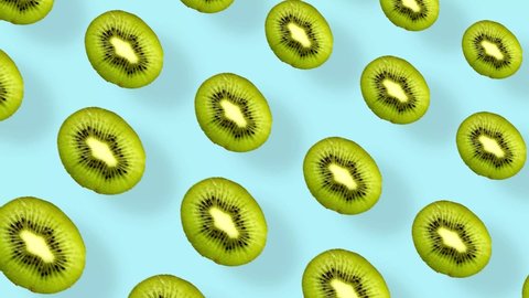 Colorful fruit pattern of fresh kiwi on blue background with shadows. Seamless pattern with kiwi sliced. Realistic animation. 4K video motion