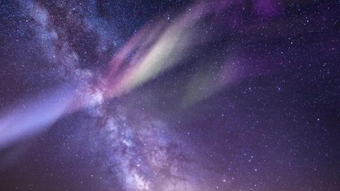 Milky way. Northern lights. Cosmos, twinkling stars, aurora. Time lapse background. Night sky. 59,94 fps