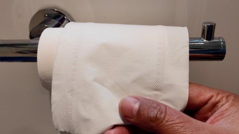 video of toilet paper rolls on a tissue hanger