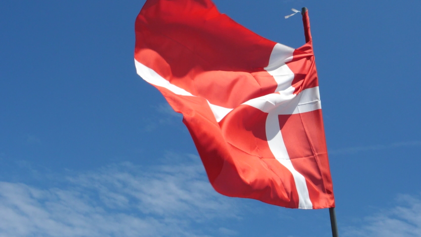 Denmark Flag Waving in the Wind in Slow Motion Close Up with blue sky background. High quality 4k footage Royalty-Free Stock Footage #1084527325
